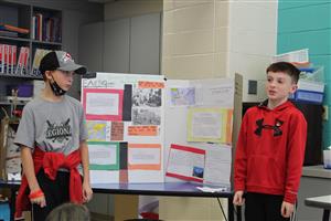 2 boys presenting a project 
