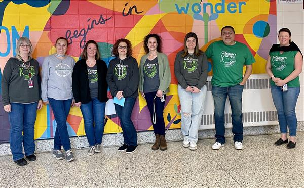  staff wearing matching tshirts 