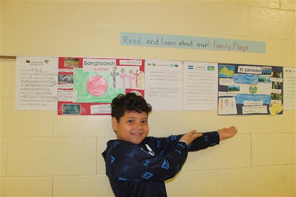  boy pointing at project 