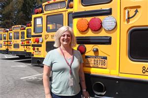 woman in front of bus 