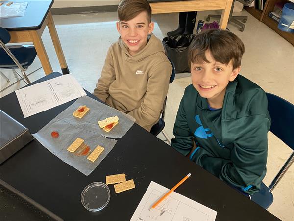  2 male students smiling 