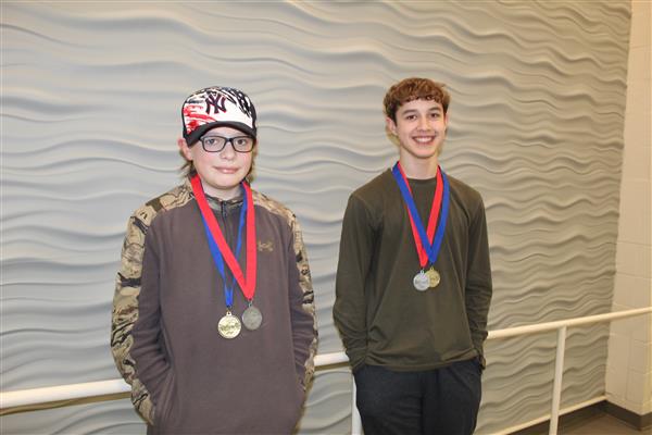  students with medals on their neck 