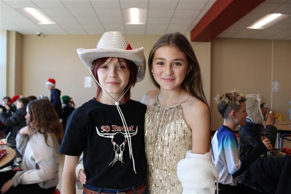 Two students in costumes. Wild west and princess.