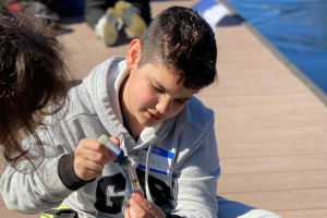 student looking at test kit