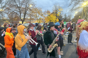  high school and middle school band students in the Halloween parade