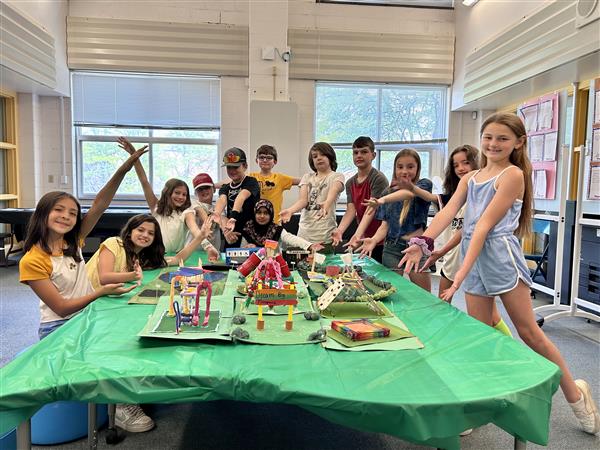  students showing off project 