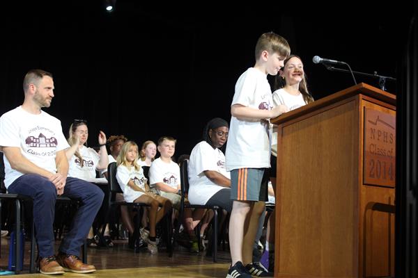  students at podium 