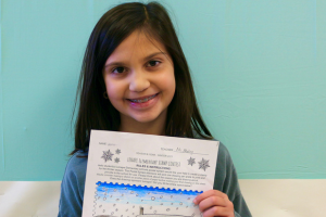  Student holding her winning certificate