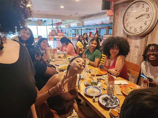 students in a restaurant eating  