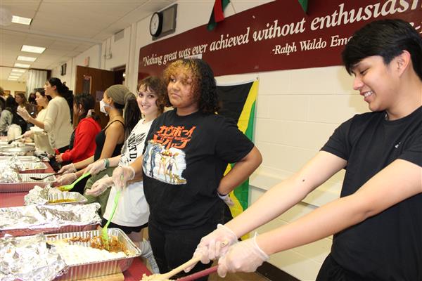  students serving food 