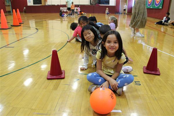  students in gym with a basketball